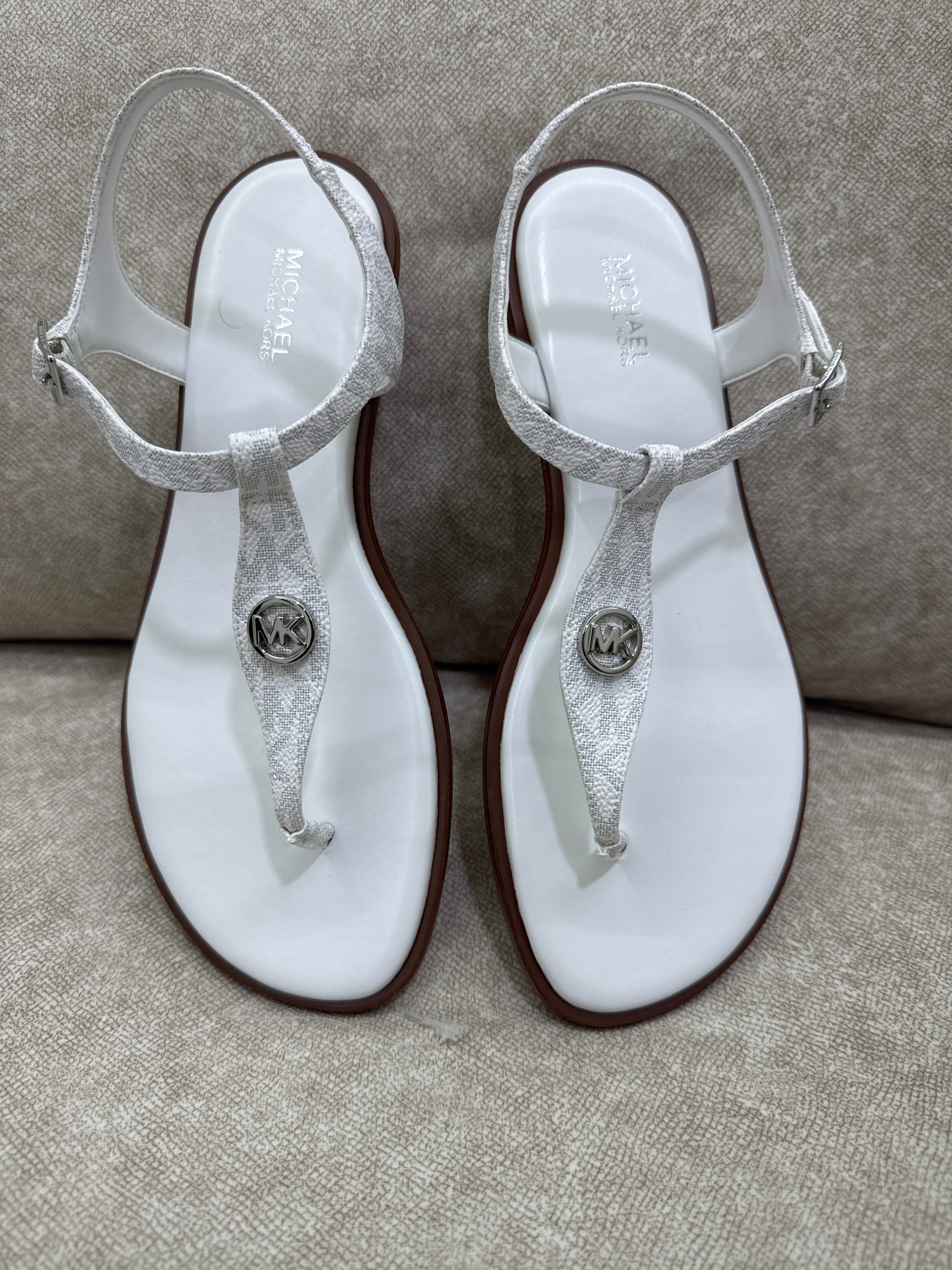 Pair of Michael Kors Mallory Signature Logo T-Strap Sandals in Bright White