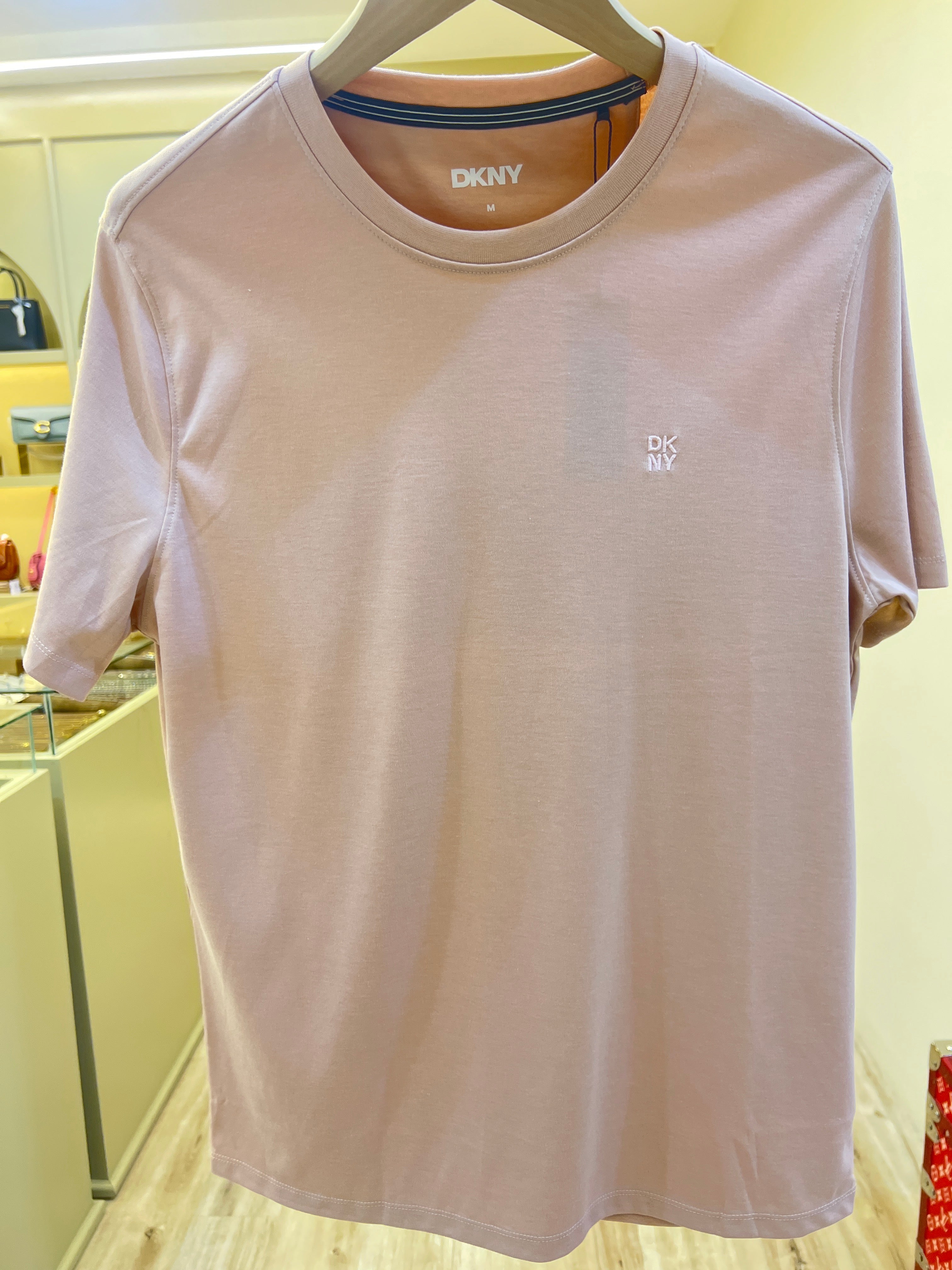 DKNY logo t-shirt features a subtle embroidered monogram on the chest and a crew neckline