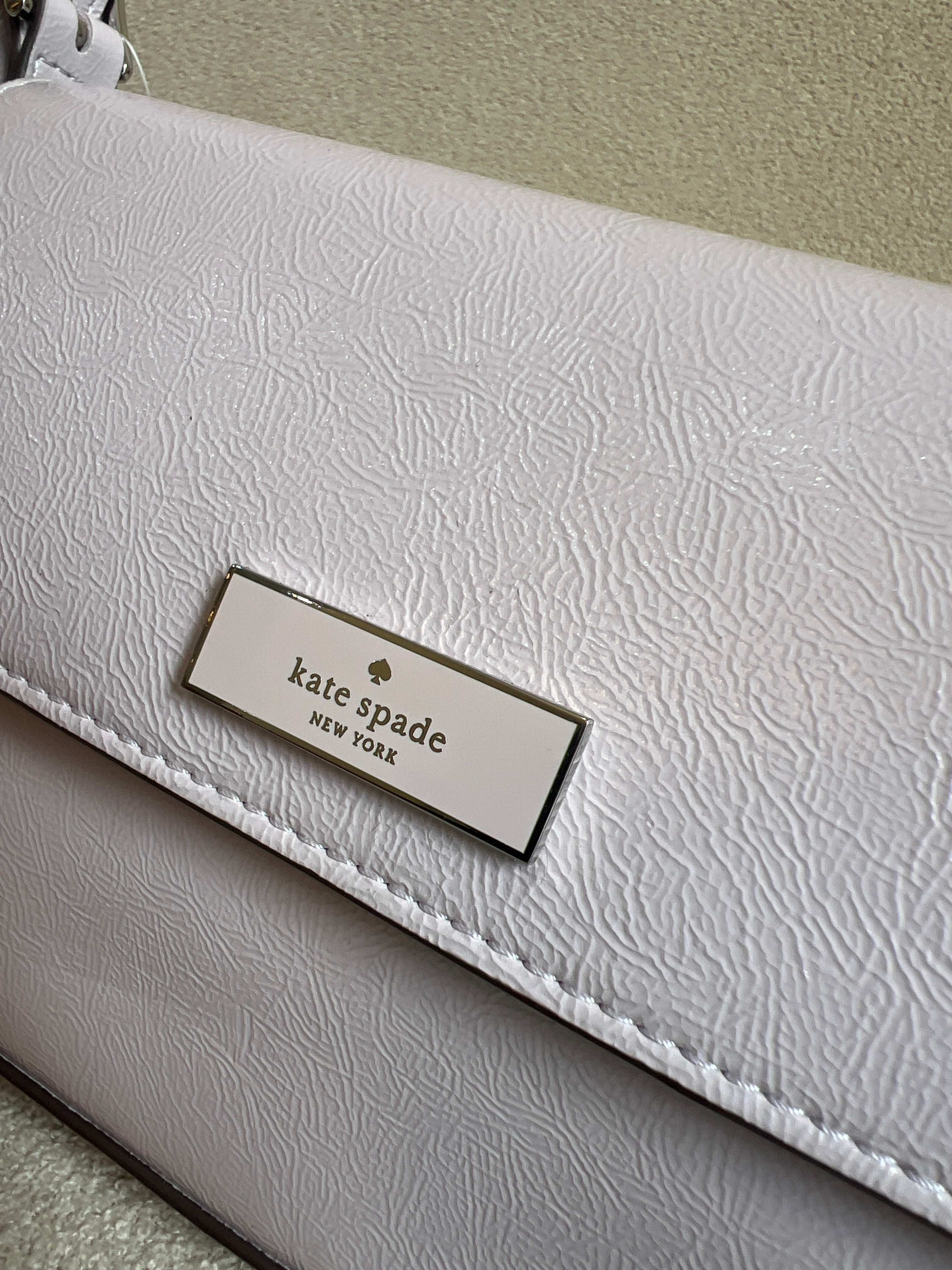 Kate Spade Bridget Small Flap Shoulder Bag in a crinkle patent leather finish