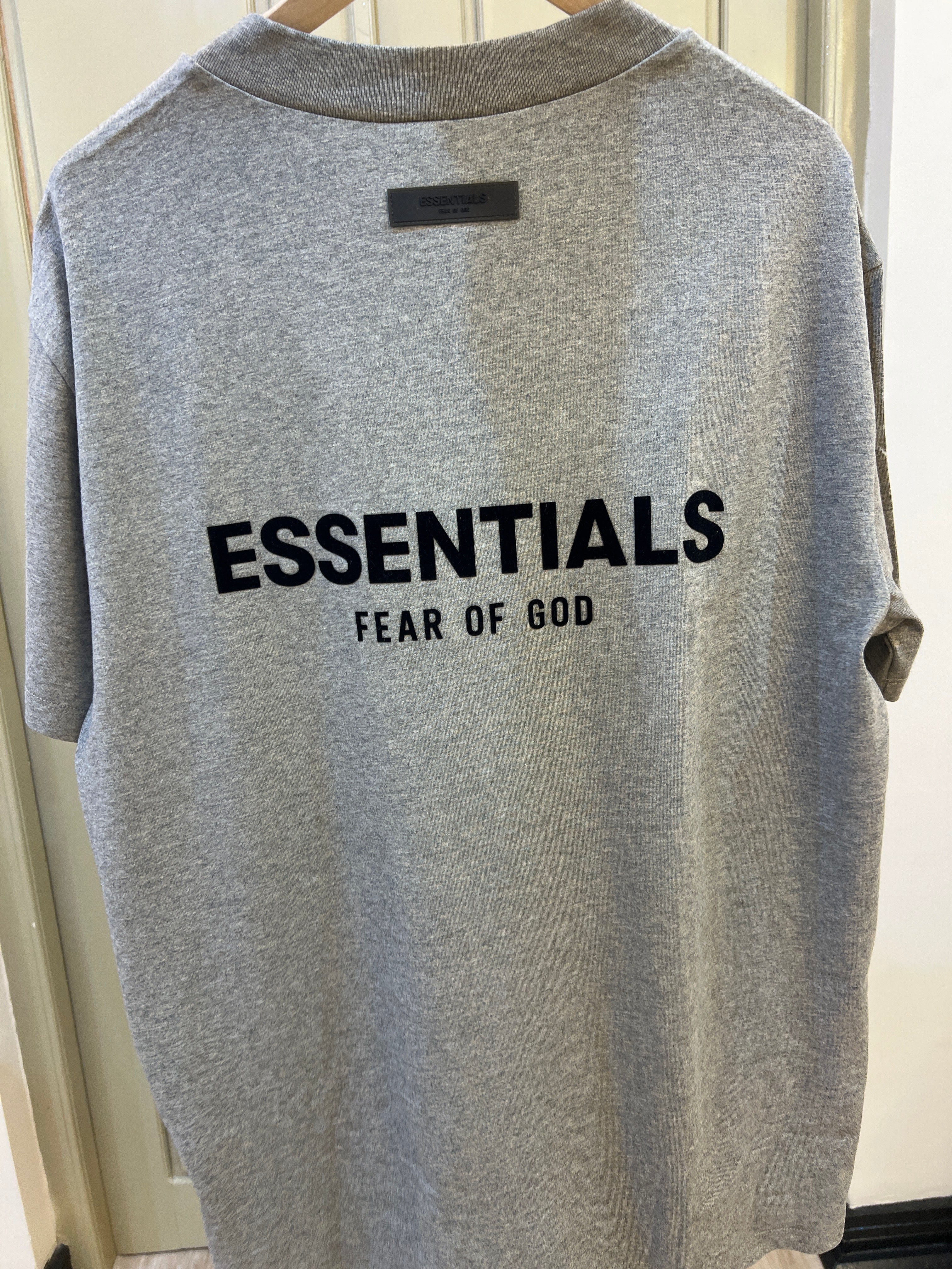 Fear of God Essentials T-shirt in dark oatmeal featuring a velvet logo on the chest