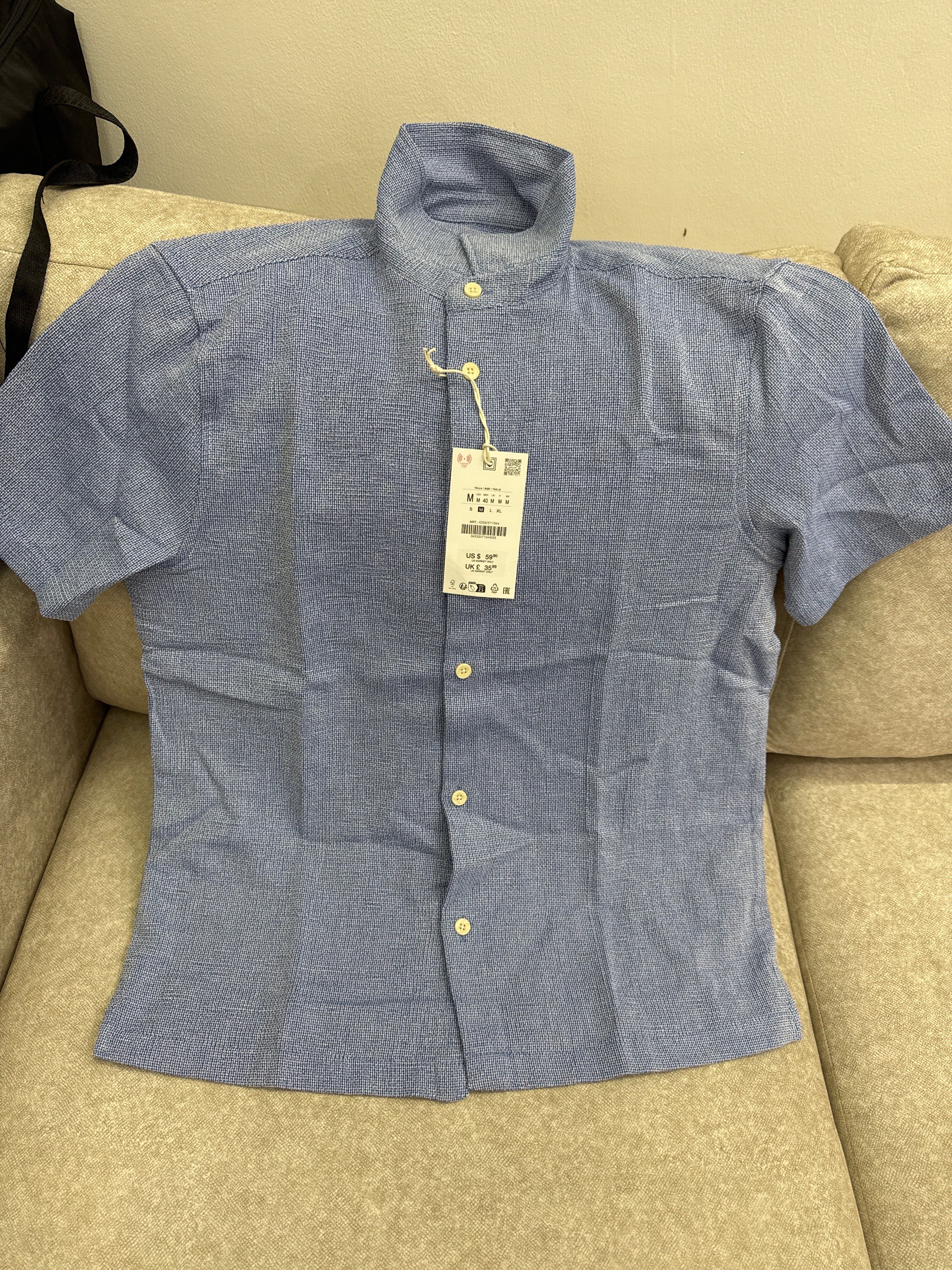 This blue textured long-sleeve shirt is a Zara brand