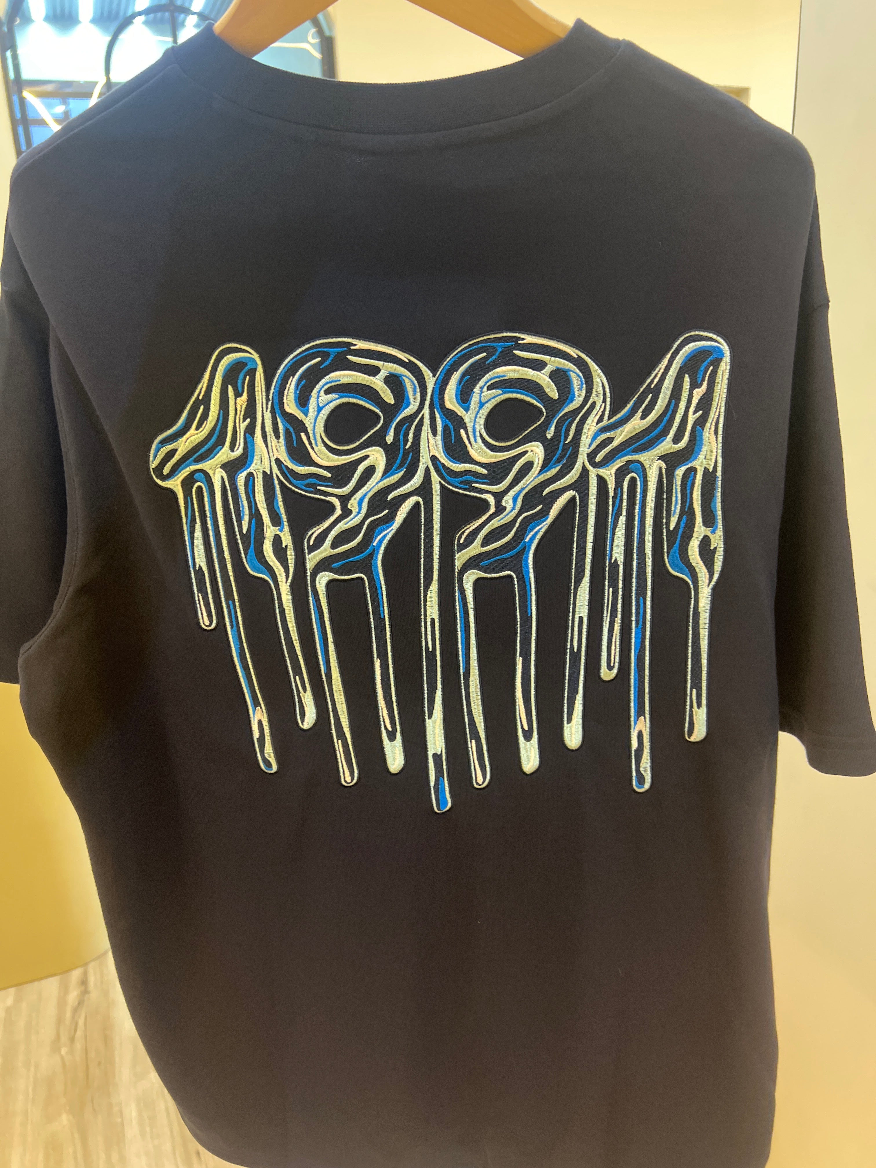 Armani Exchange crew neck t-shirt featuring a distinctive graphic logo on the chest back print graphic t-shirt featuring a stylized "1991" design Navy blue