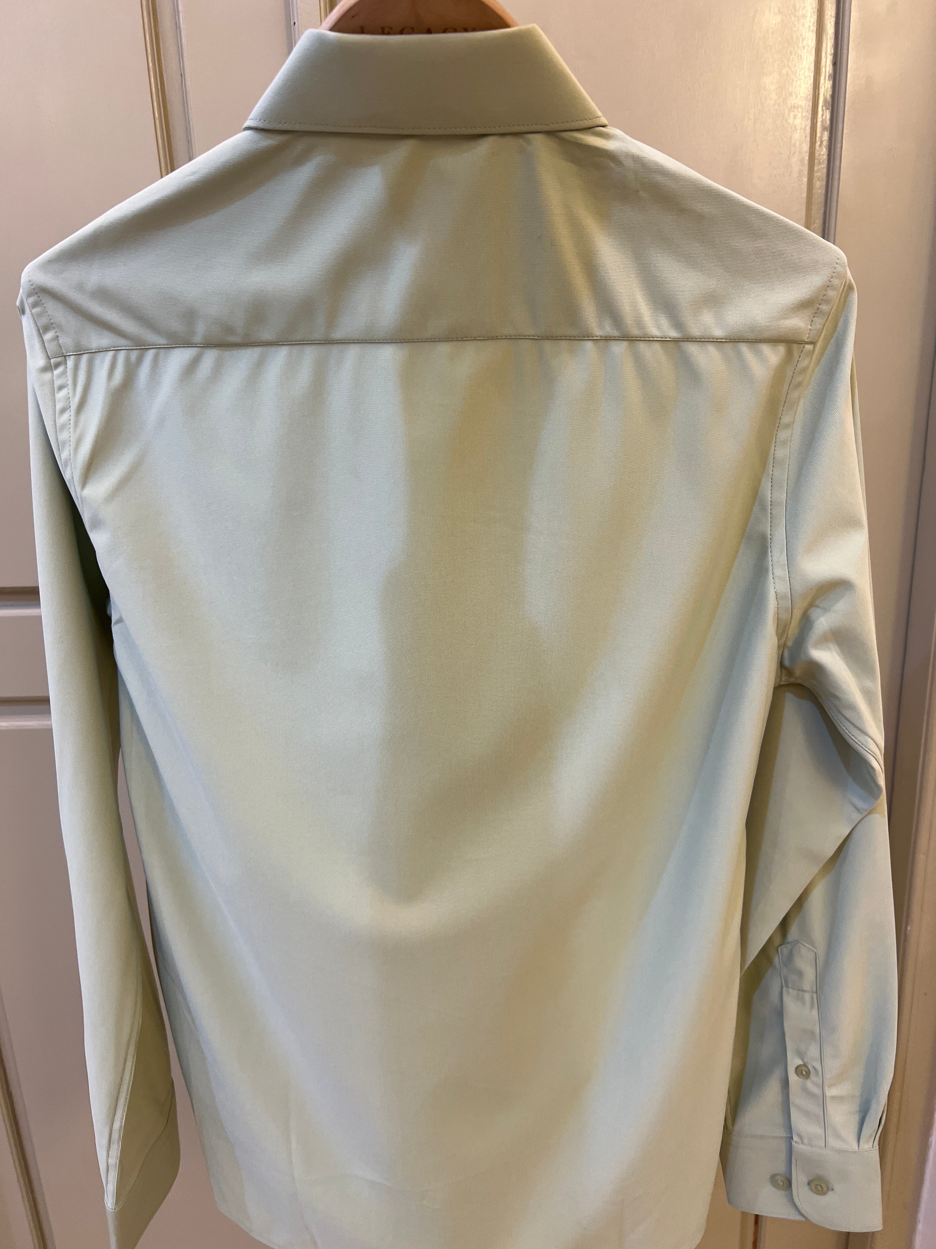 DKNY long-sleeve dress shirt features a classic button-down front and a structured collar