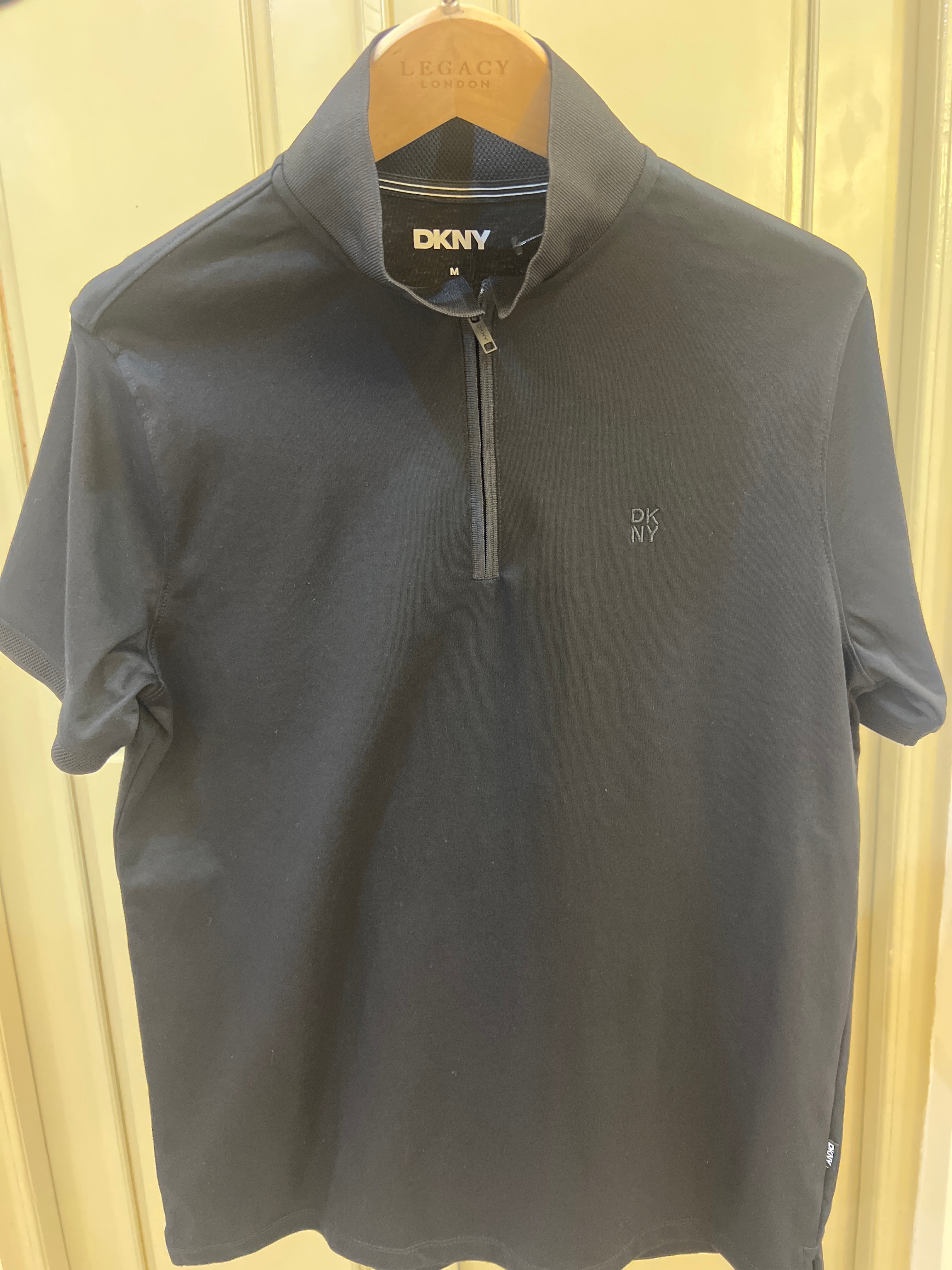 DKNY quarter-zip sweater is made from a lightweight, stretch fabric