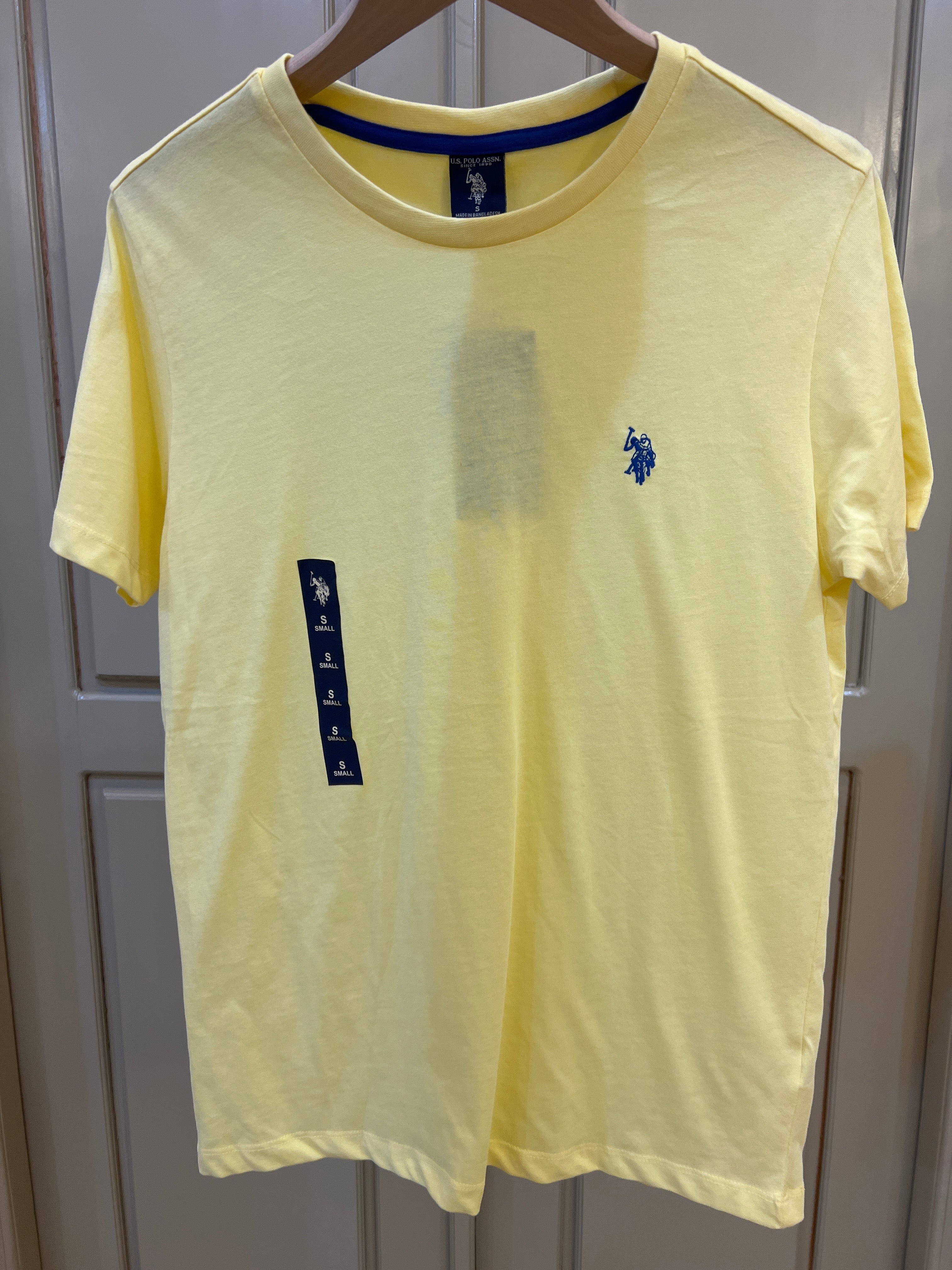 S. Polo Assn. yellow crew neck t-shirt features a blue embroidered pony logo