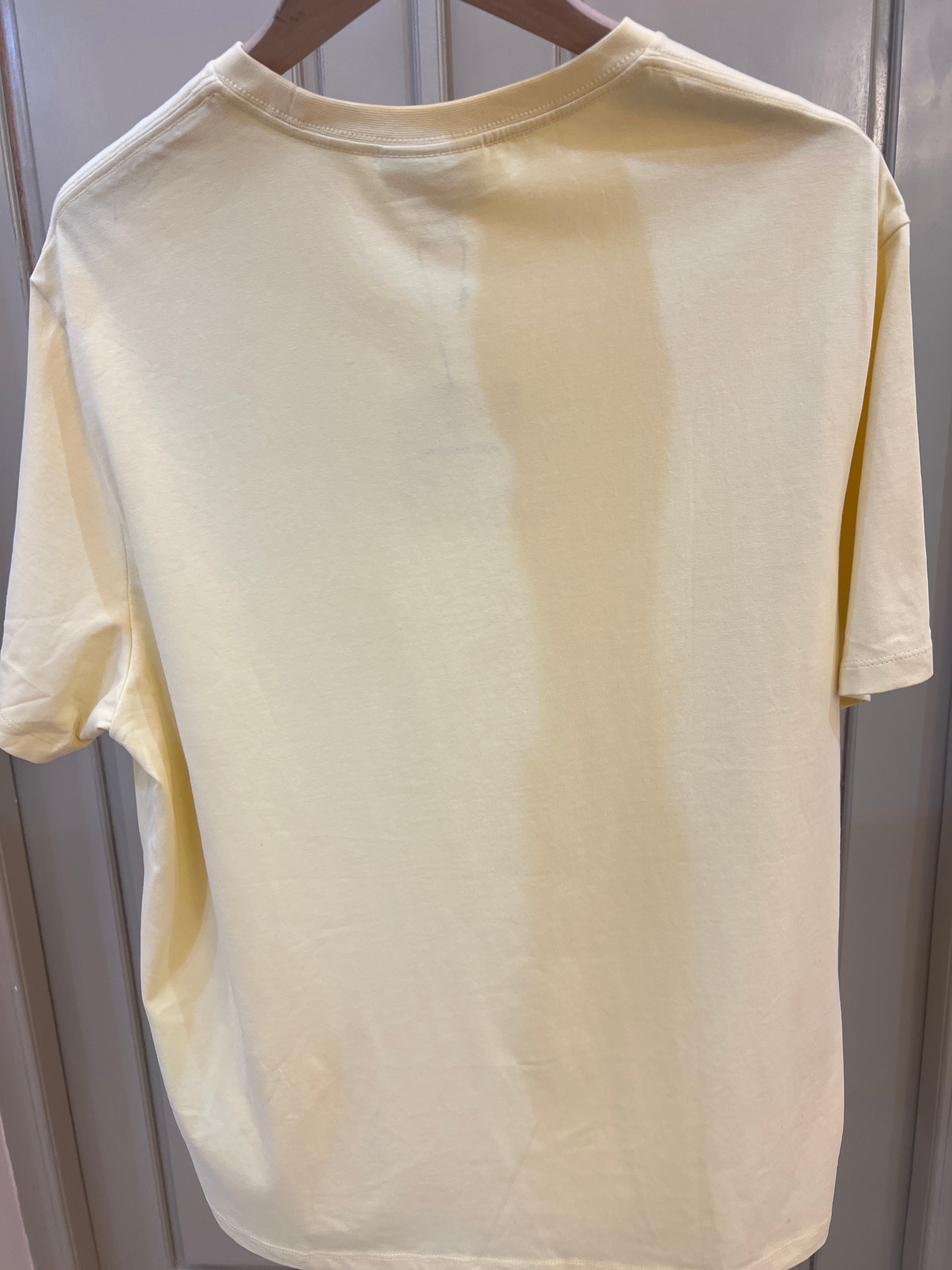 Calvin Klein Logo Square Graphic Relaxed T-Shirt features a blue stacked text logo on the chest