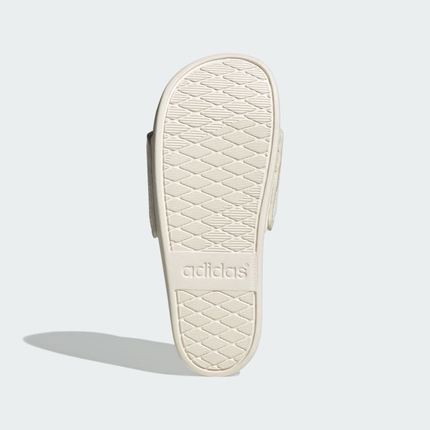 Adidas Adilette Comfort Slides in the white or off-white colorway