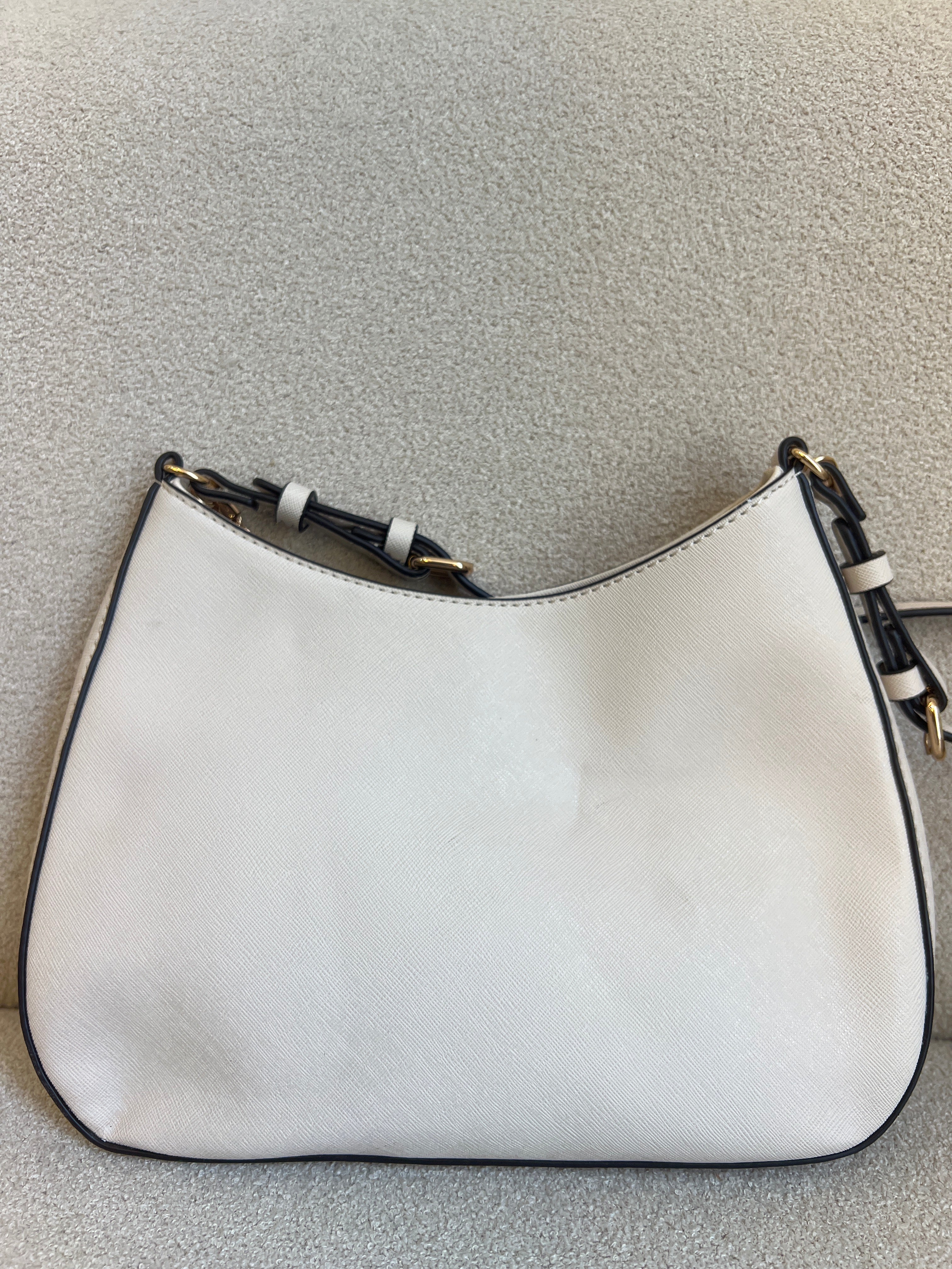GUESS Noelle Saffiano Shoulder Bag in bone white features a gold-tone chain strap and a signature triangular logo plaque