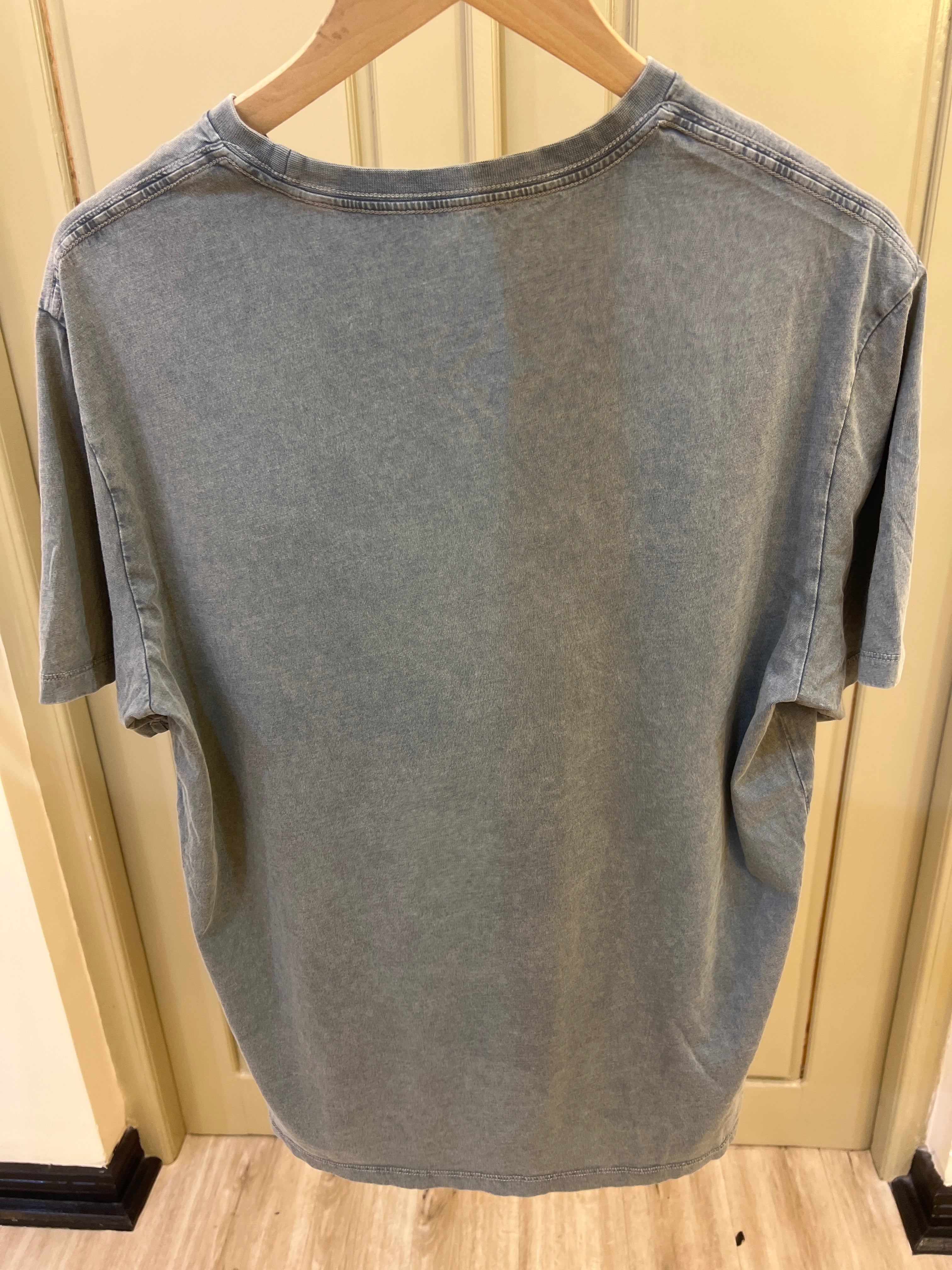 Calvin Klein Acid Wash Monogram Classic T-Shirt features a subtle monogram logo on the chest and a worn-in texture