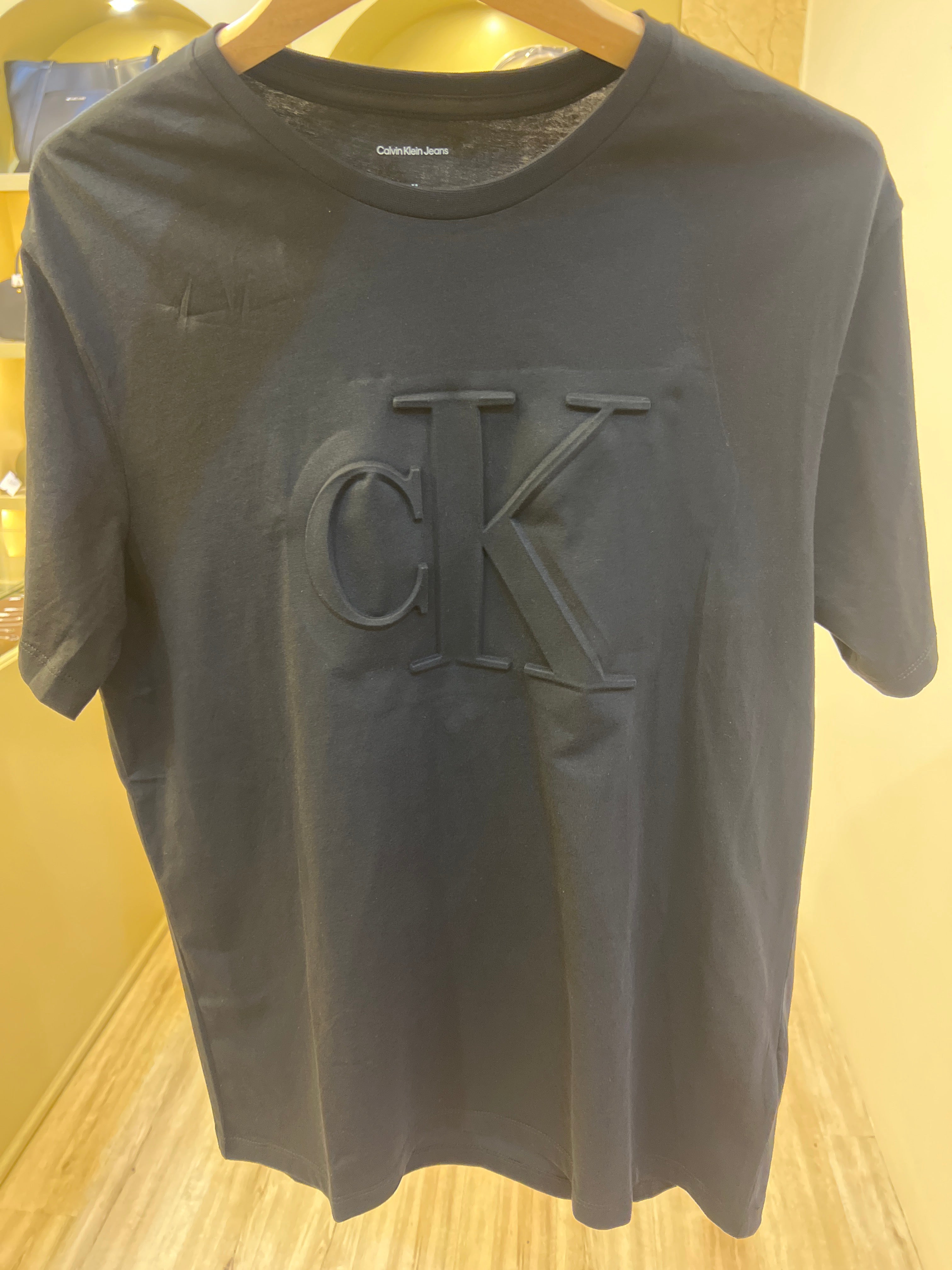 Black Calvin Klein Jeans crew-neck t-shirt featuring an embossed logo on the chest