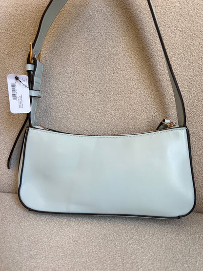 GUESS Tasha Mini Shoulder bag features a light blue synthetic exterior and a polished gold-tone triangular logo plaque