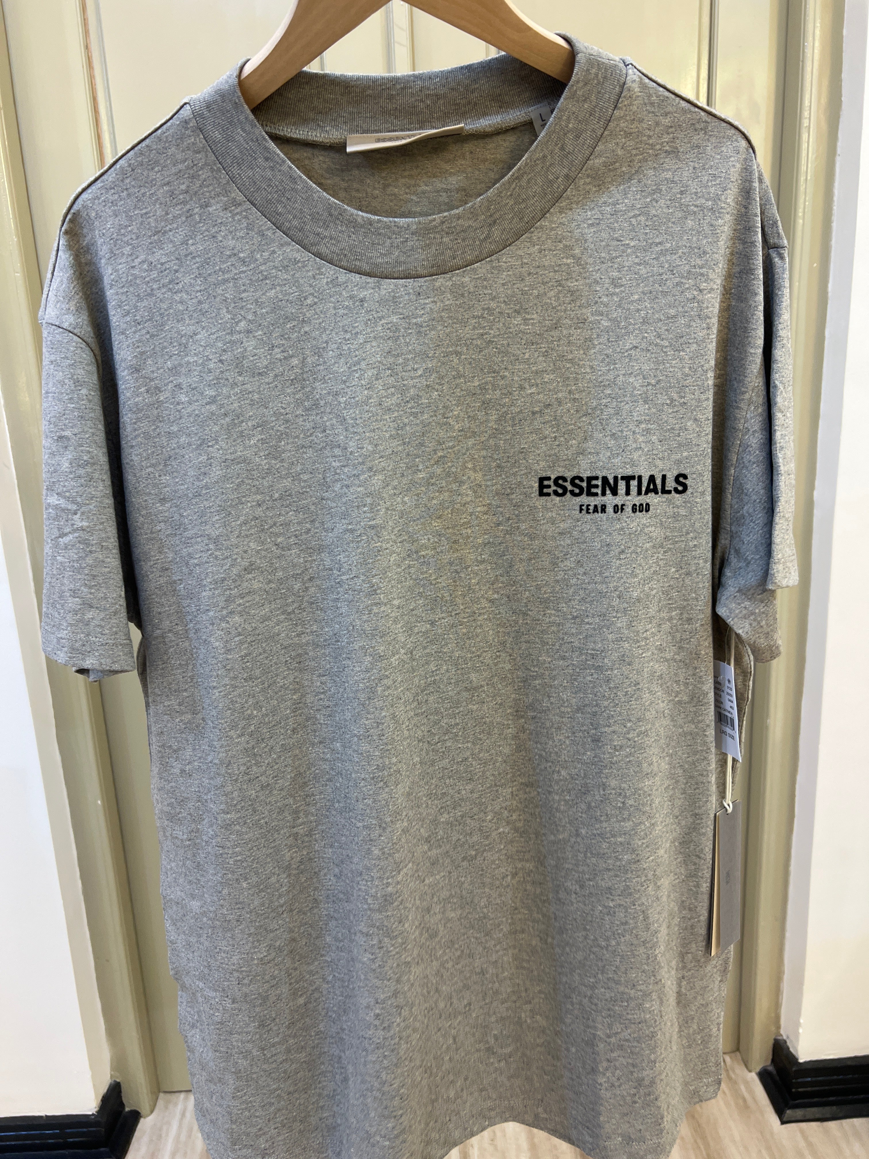 Fear of God Essentials T-shirt in dark oatmeal featuring a velvet logo on the chest