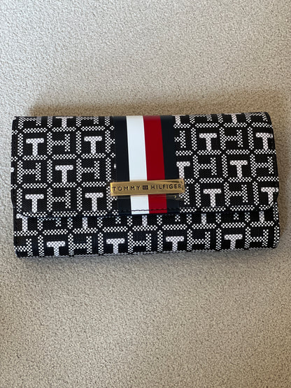 Tommy Hilfiger Waverly II-Flap Continental Wallet features a coated square monogram pattern and a varsity stripe