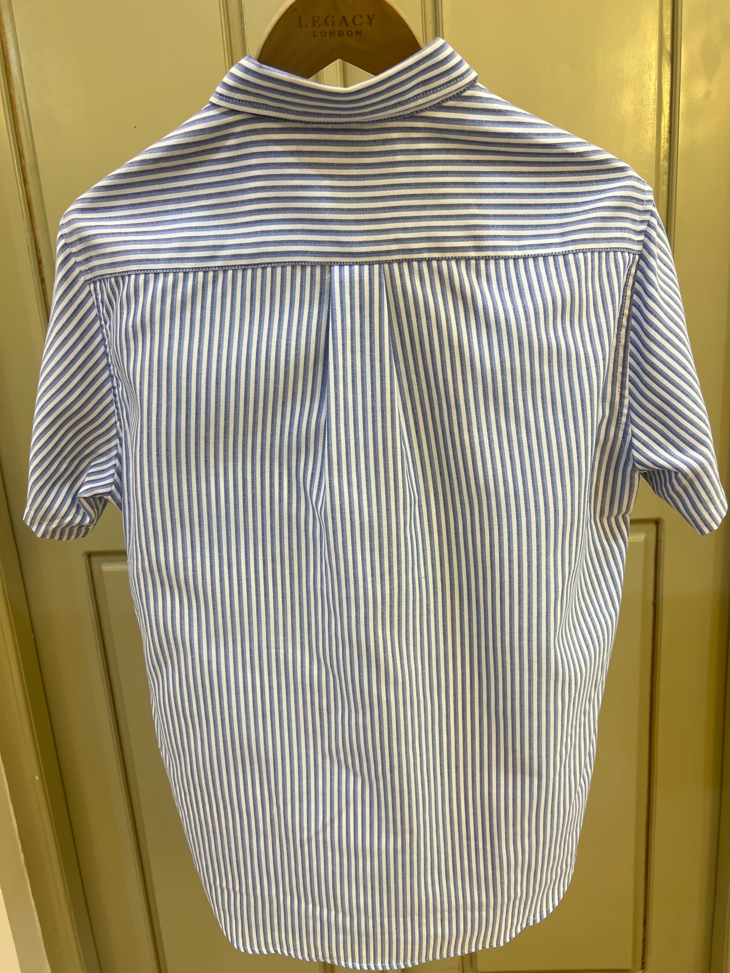 S. Polo Assn. striped shirt features a button-down collar and an embroidered logo on the chest pocket