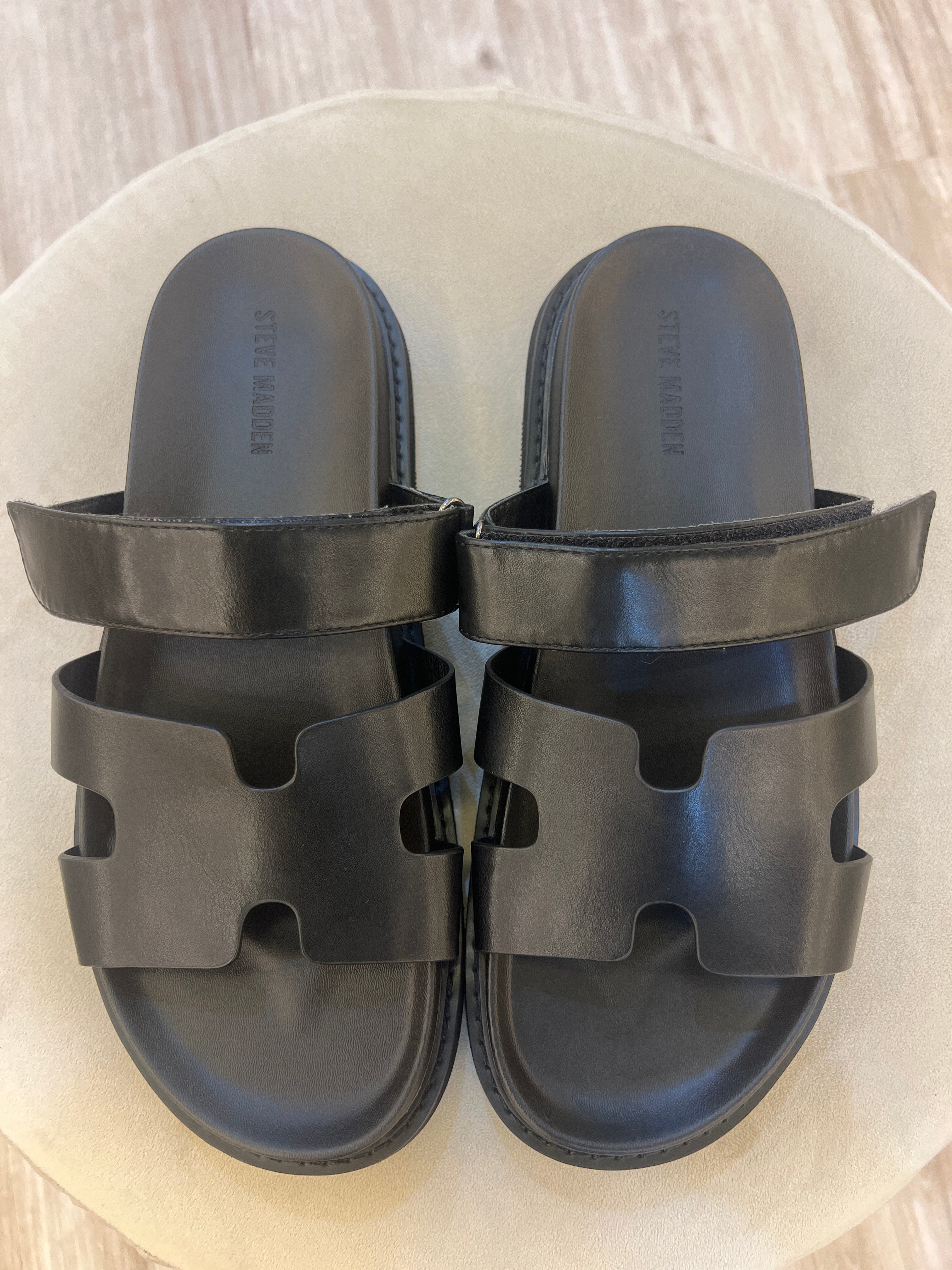 Steve Madden Maiven model, which feature a distinct H-shaped cutout strap and an adjustable top strap