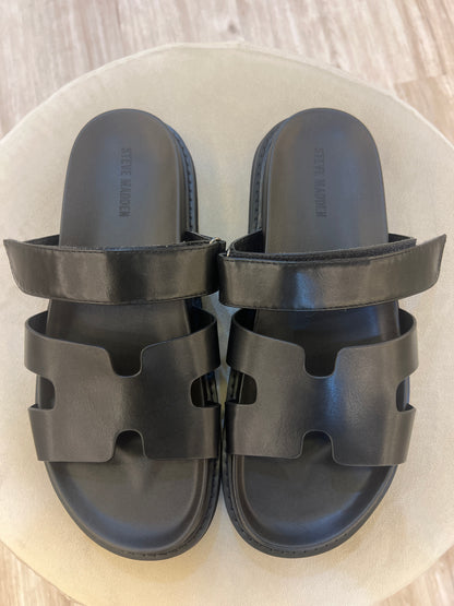 Steve Madden Maiven model, which feature a distinct H-shaped cutout strap and an adjustable top strap