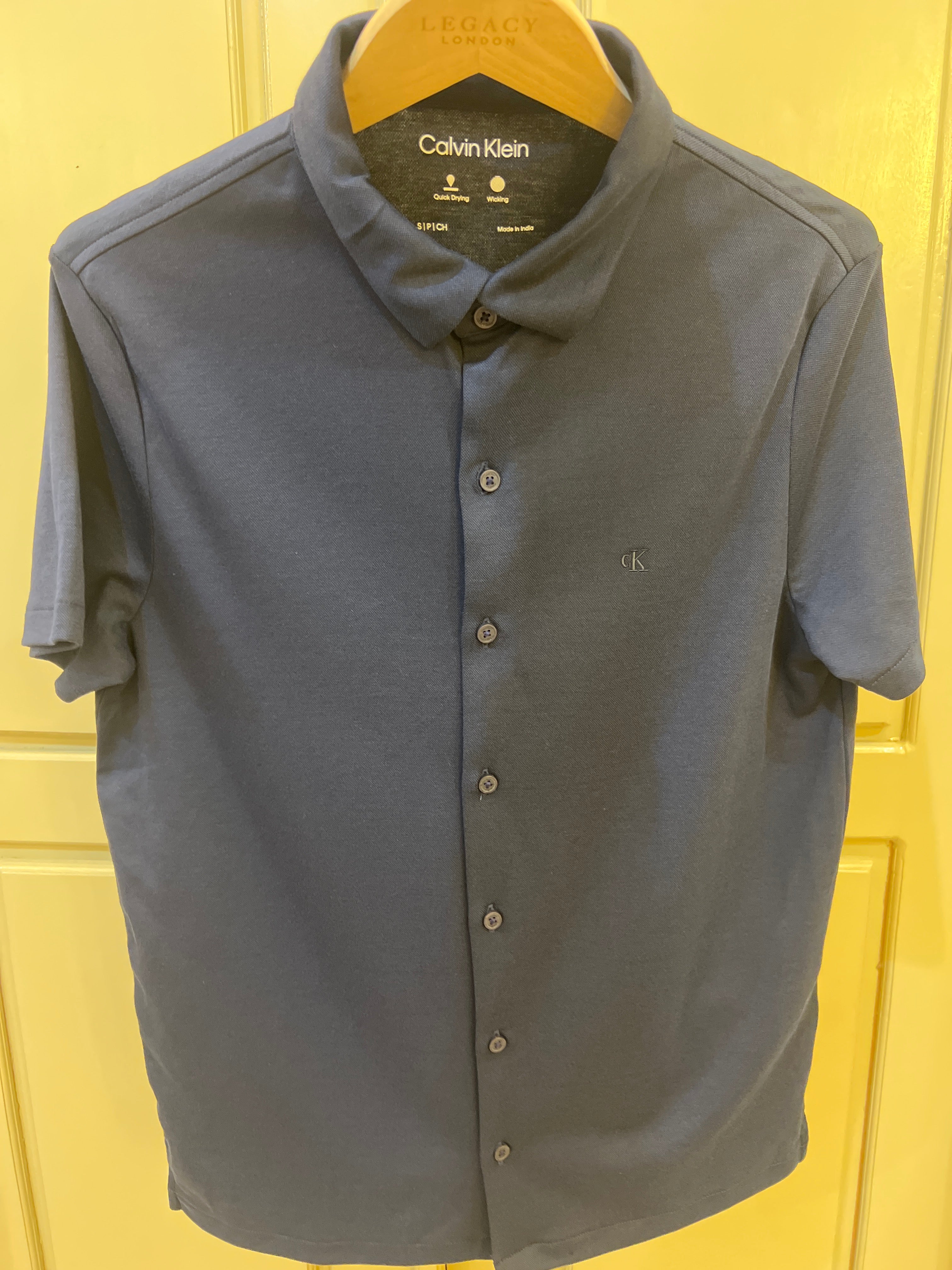 Calvin Klein Men's Slim Fit Shirt in a solid navy blue color, featuring a button-down collar