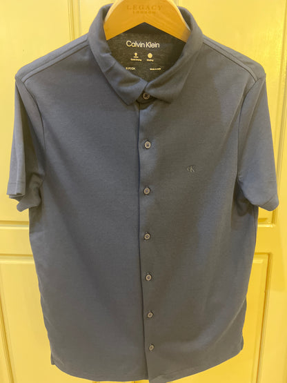 Calvin Klein Men's Slim Fit Shirt in a solid navy blue color, featuring a button-down collar