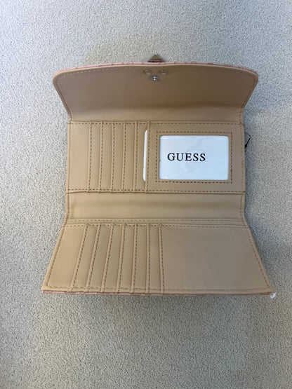 Guess Viviette tri-fold wallet features a textured, light pink monogram exterior and a prominent triangular logo plaque