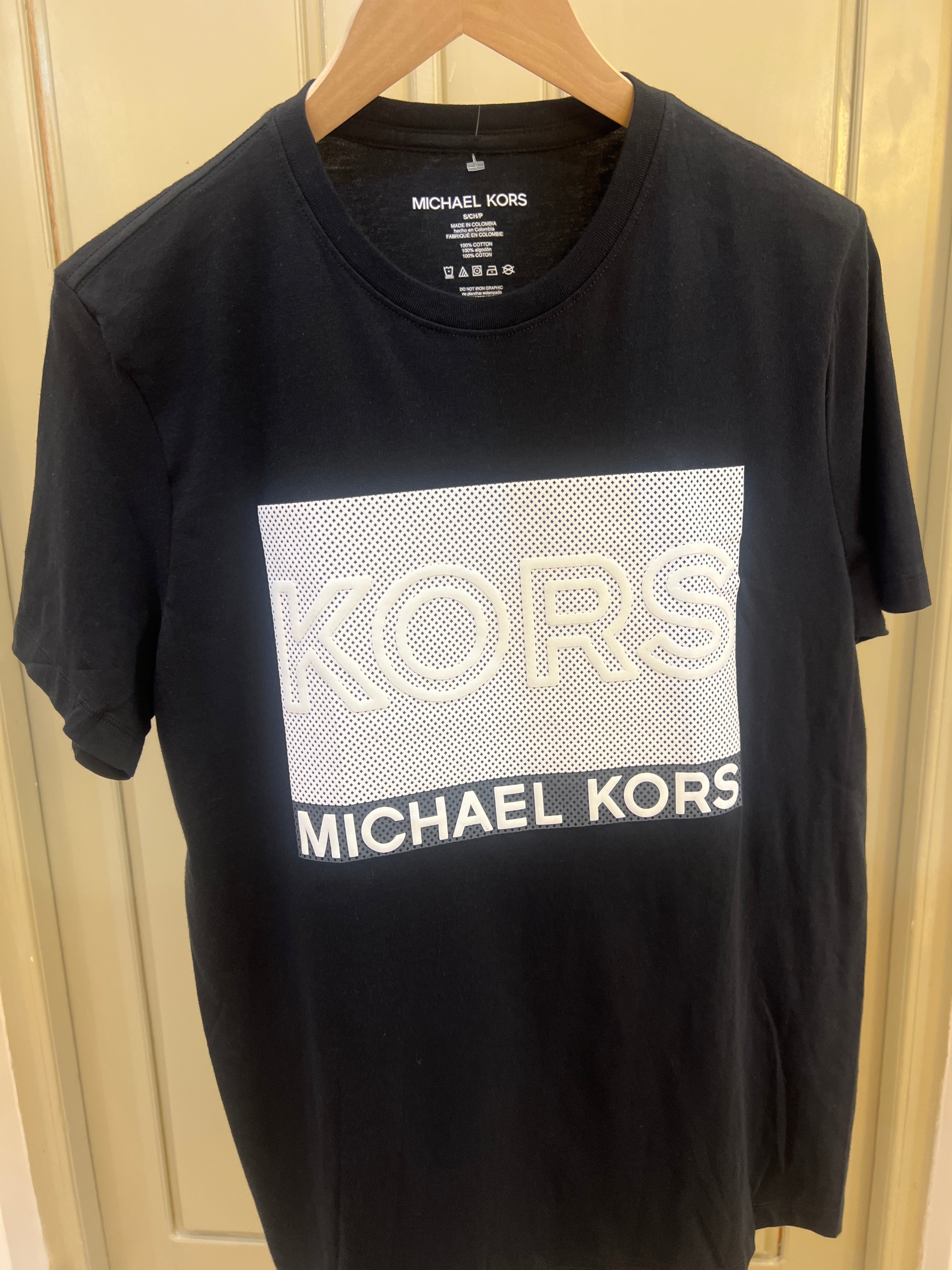 Michael Kors crew neck T-shirt featuring a black color scheme and a textured white box graphic