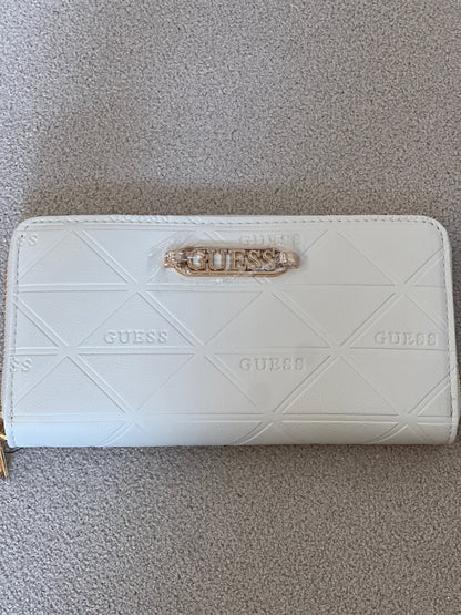 Guess wallet features a quilted triangular pattern and a prominent gold-toned brand logo on the front