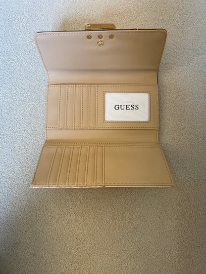Guess wallet featuring a monogram logo pattern and a structured metallic logo plate