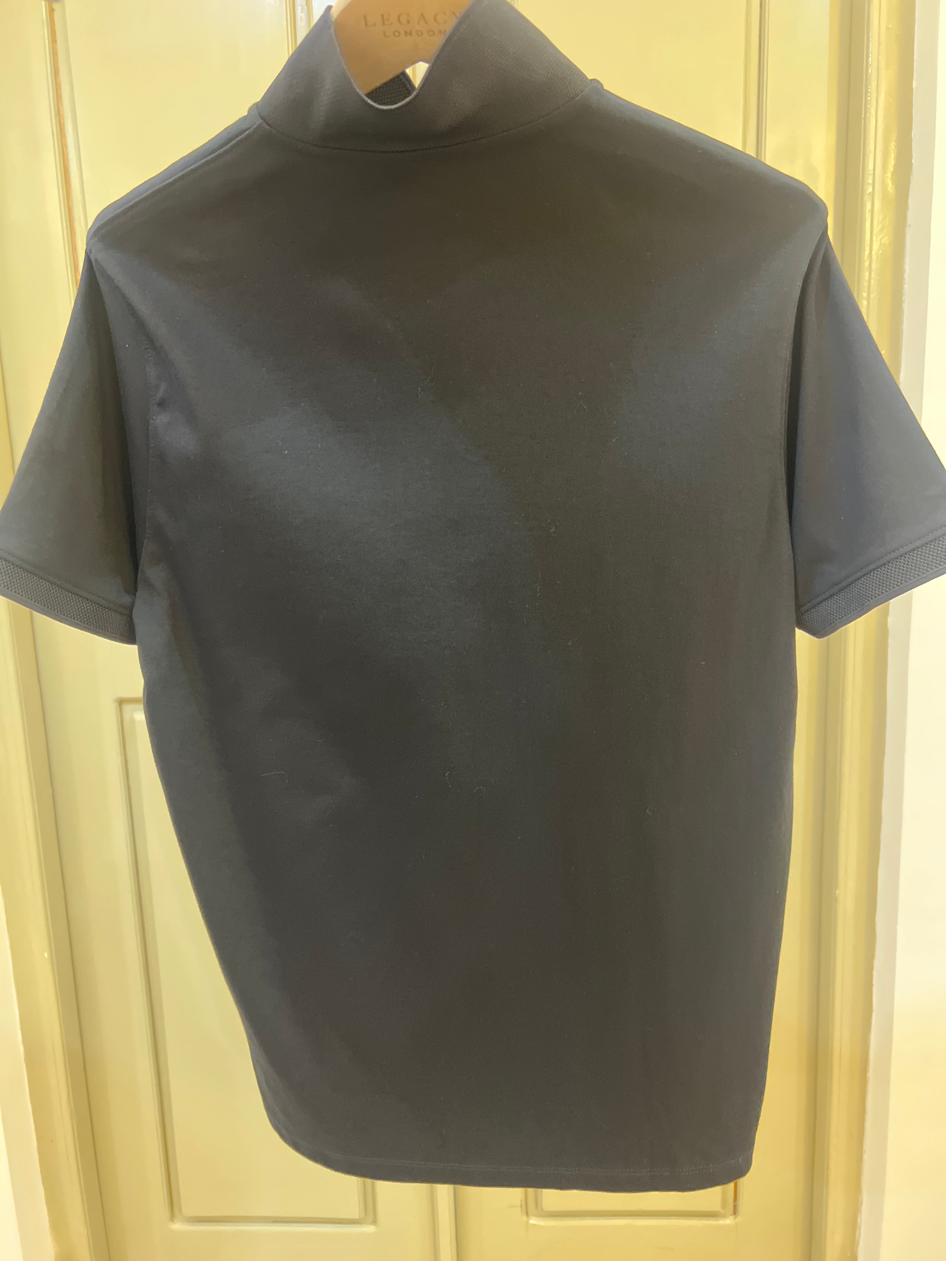 DKNY quarter-zip sweater is made from a lightweight, stretch fabric
