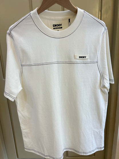 T-shirt by DKNY features contrasting black stitching details and a relaxed fit