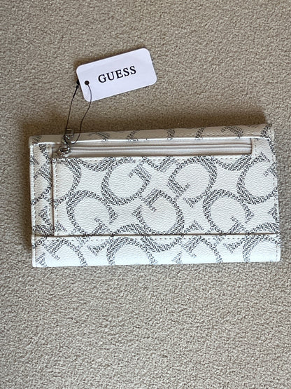 Guess Granby SLG Slim Clutch features an all-over logo print and a snap button closure