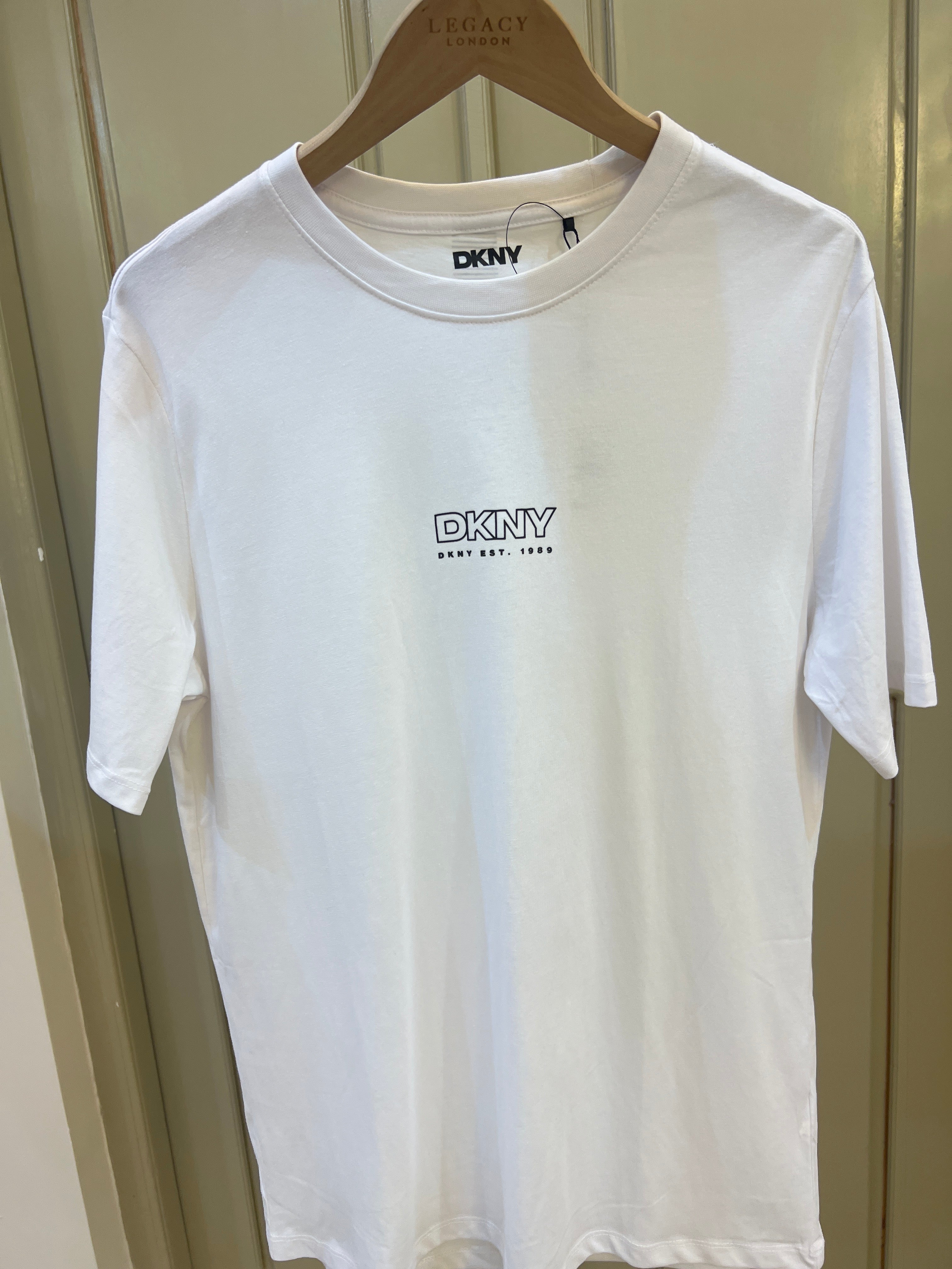 DKNY t-shirt features a central chest logo with the "DKNY" branding
