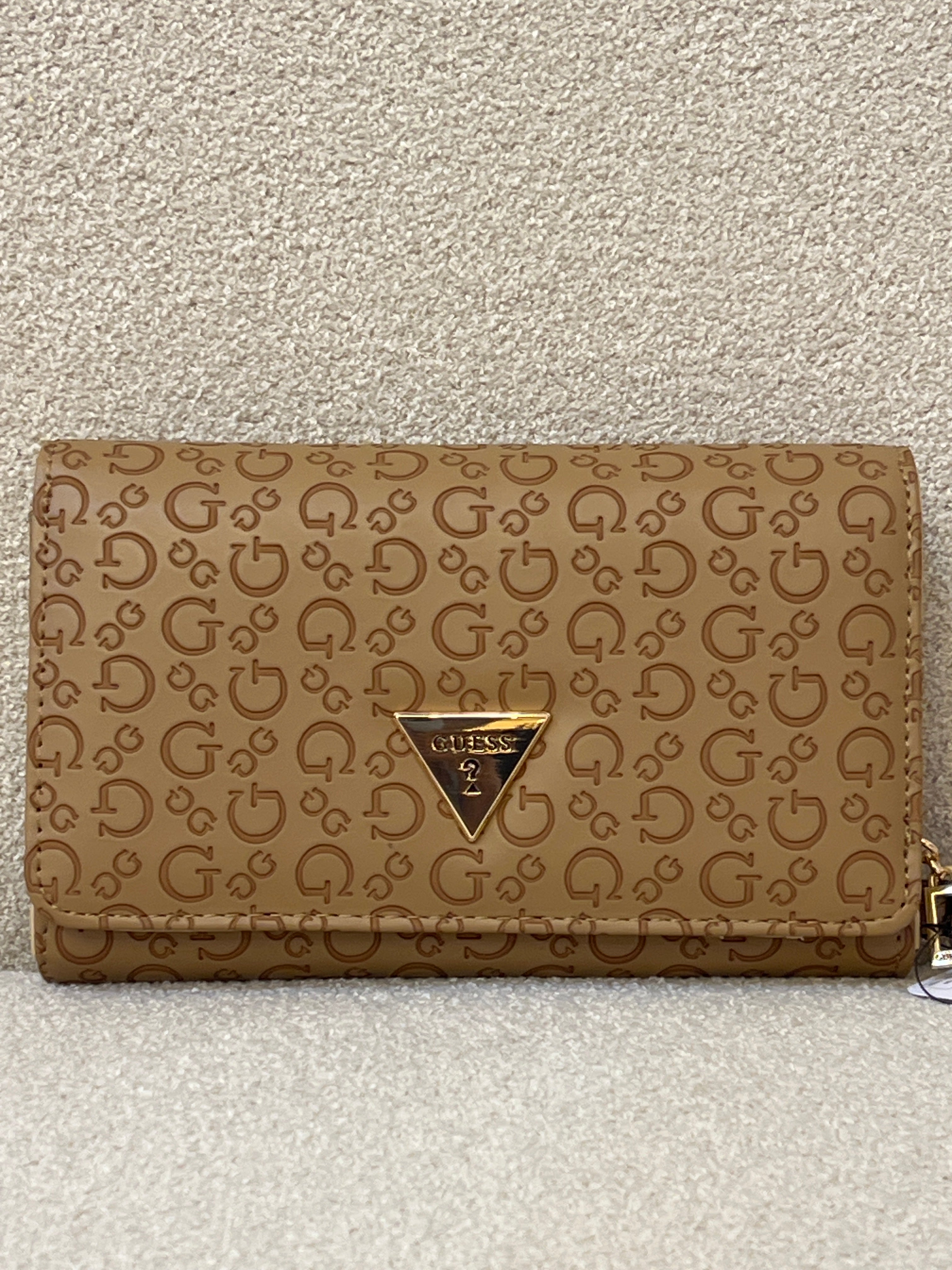 Guess Julie Phone Organizer Wallet, a brown faux-leather wristlet featuring an allover logo print and a gold-tone triangle logo on the front