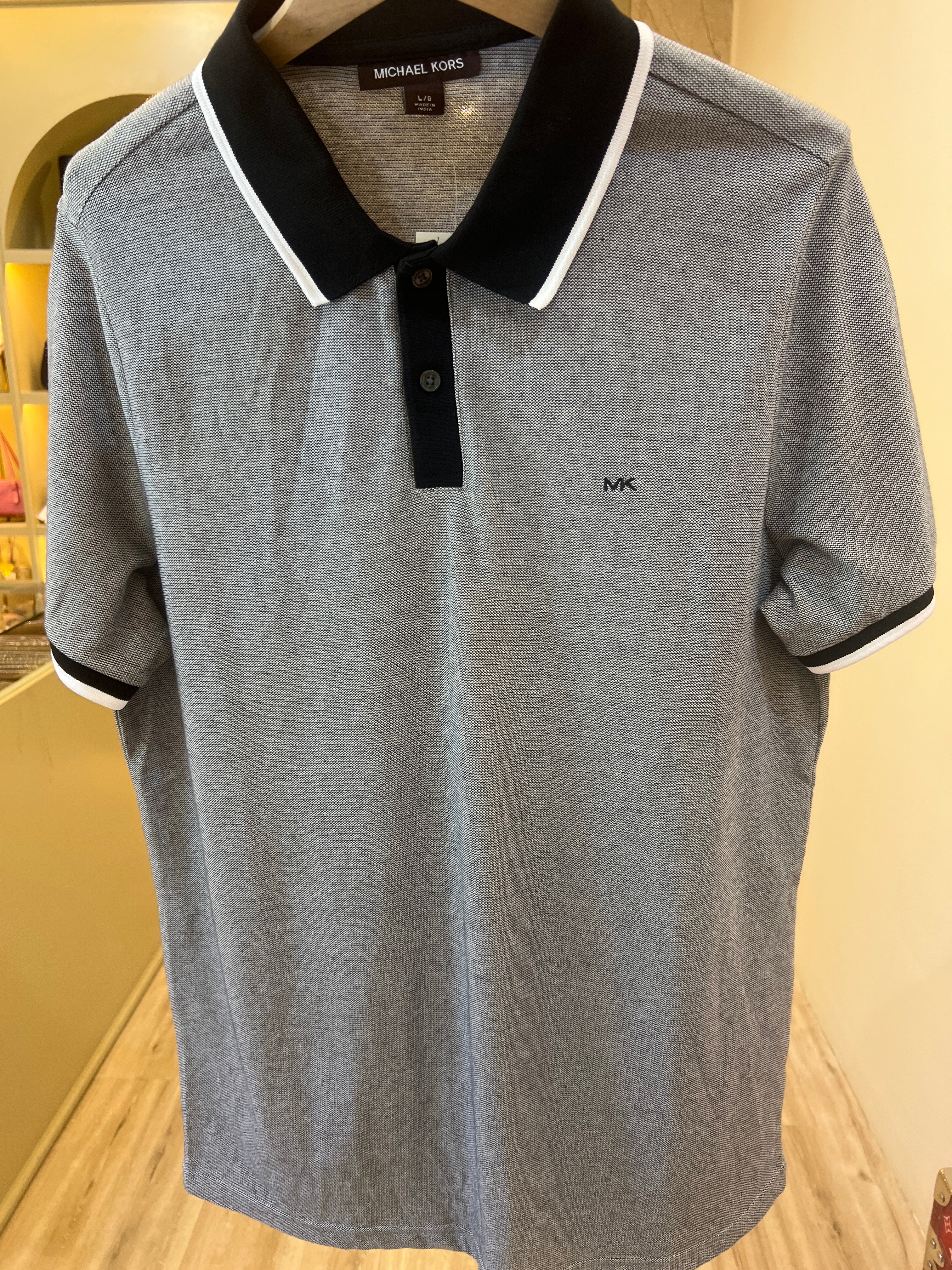 Michael Kors Greenwich polo shirt featuring a distinctive contrast trim and embroidered MK logo