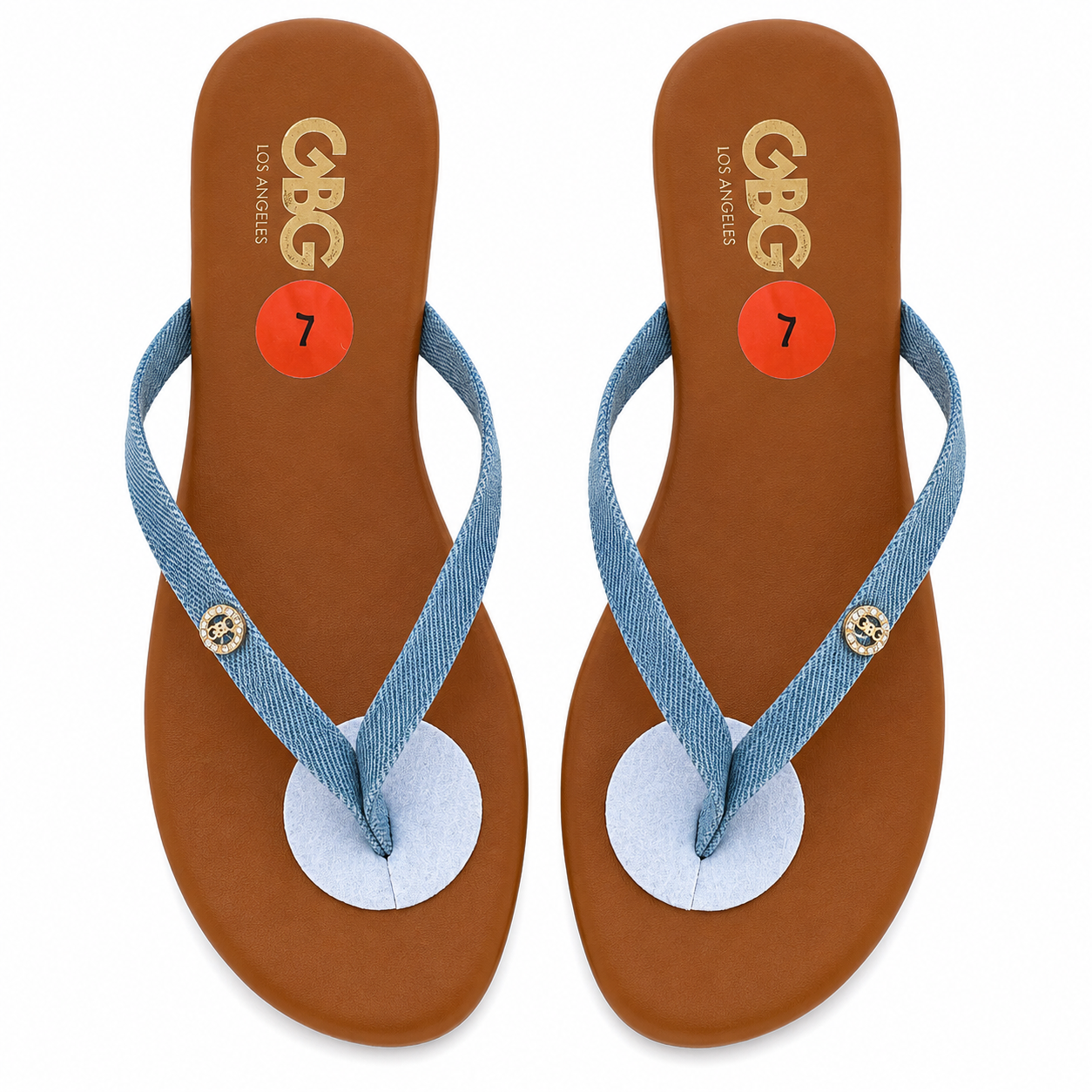 GBG Los Angeles sandals feature a light blue denim strap and a tan footbed