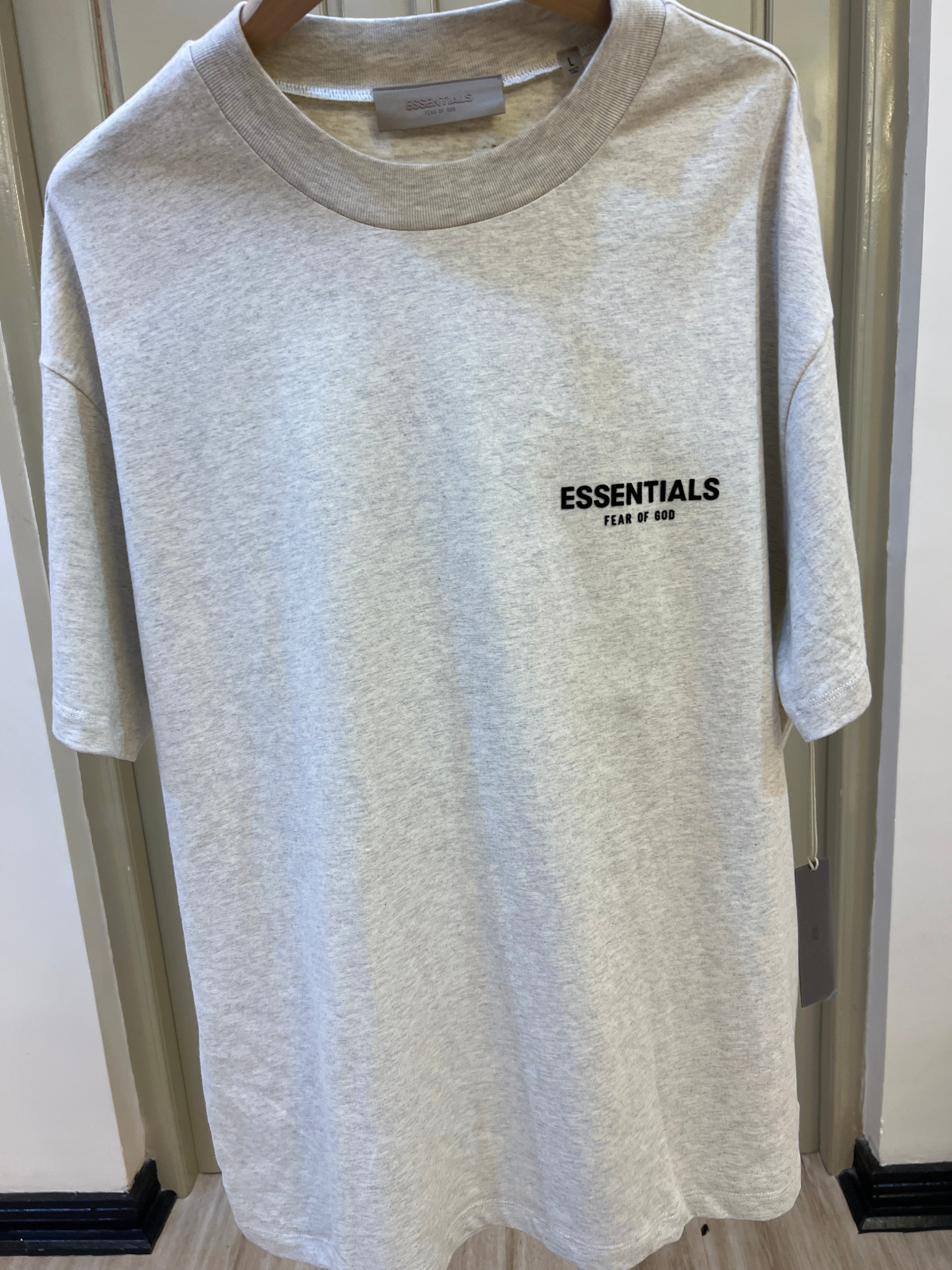 Fear of God Essentials t-shirt features a small black rubberized logo on the left chest