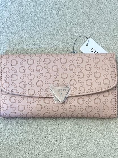 Guess Viviette tri-fold wallet features a textured, light pink monogram exterior and a prominent triangular logo plaque