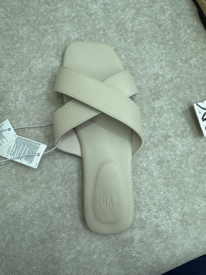 beige crossover strap sandals are the Gap Criss-Cross Sandals