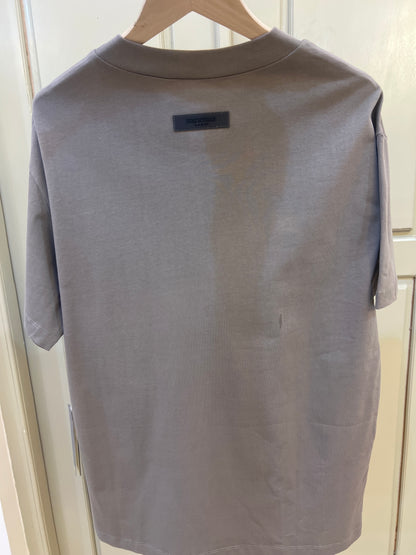 Fear of God Essentials Desert Taupe T-shirt featuring a prominent white logo on the chest