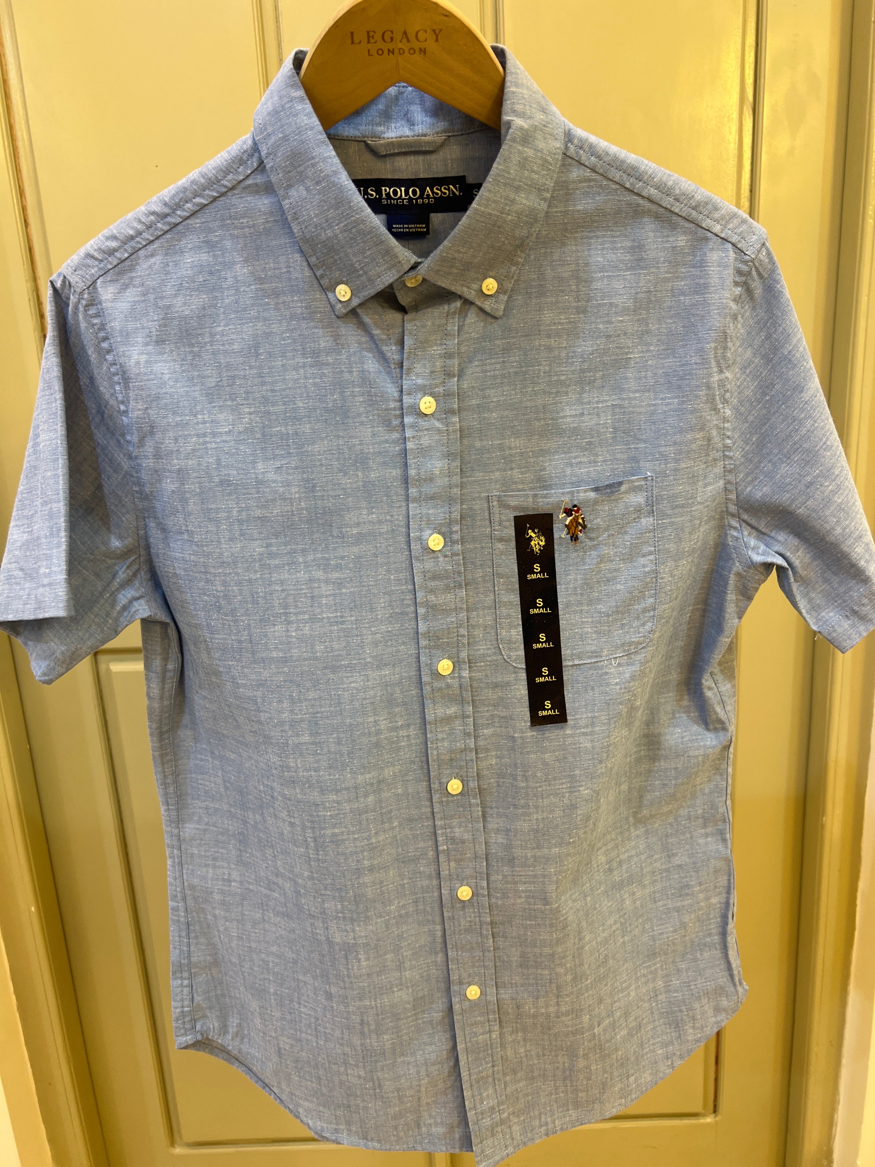 S. Polo Assn. short-sleeve oxford shirt featuring a button-down collar and a small embroidered logo on the chest pocket