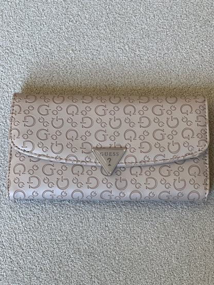 Guess "Viviette" SLG slim clutch wallet in a latte color with an all-over embossed logo pattern